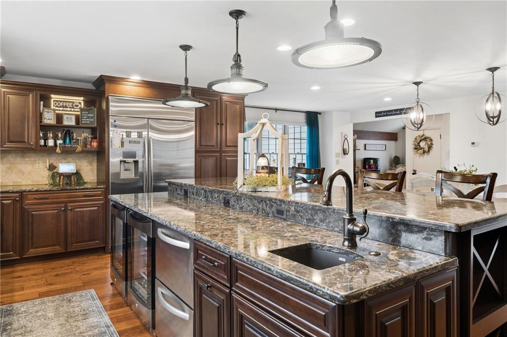 55 Spring Valley Drive Washington, PA 15301 - Photo 10 of 36 a kitchen with a stove a sink and a refrigerator