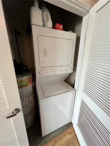 a view of a room with gym equipment and a large window