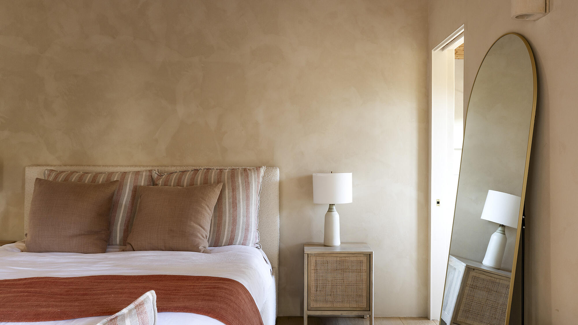 1545 San Roque Road Santa Barbara, CA 93105 - Photo 23 of 60 a bed sitting in a bedroom next to a lamp