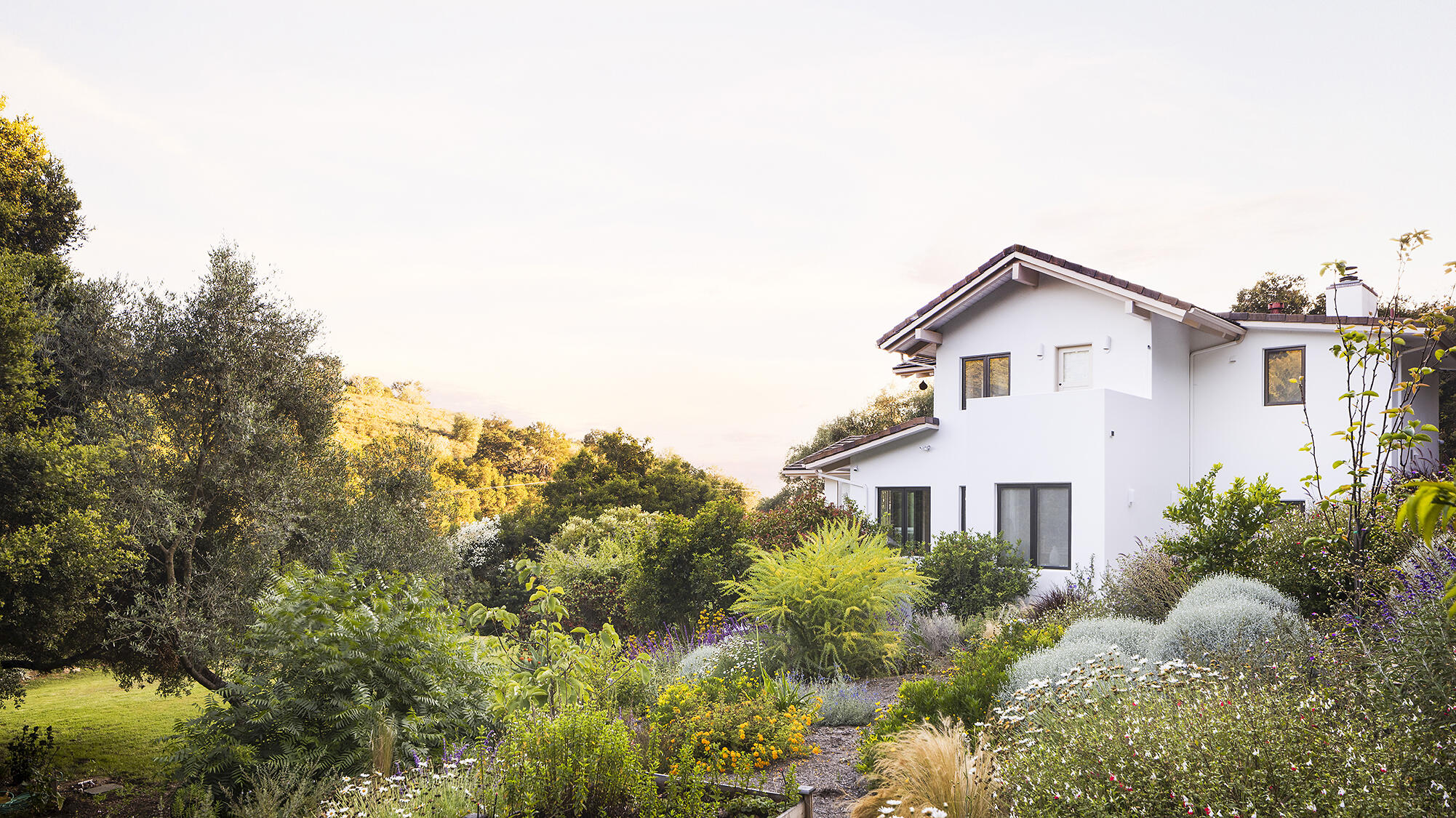 1545 San Roque Road Santa Barbara, CA 93105 - Photo 45 of 60 a front view of a house with a yard and garage