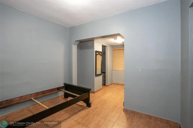 a room with a bed and mirror