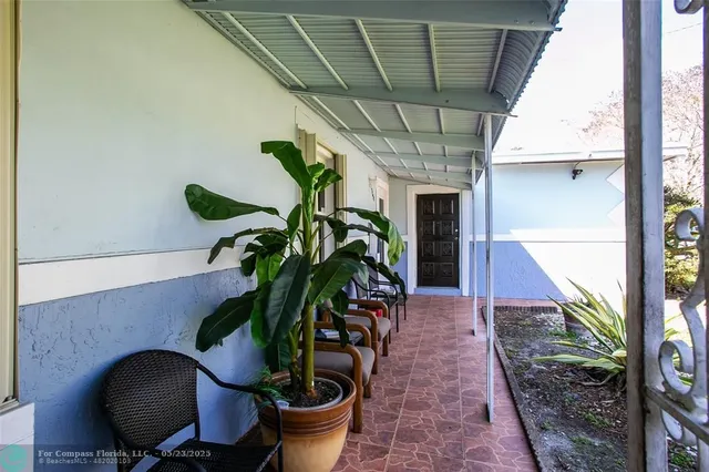 a potted plant sitting in front of a house