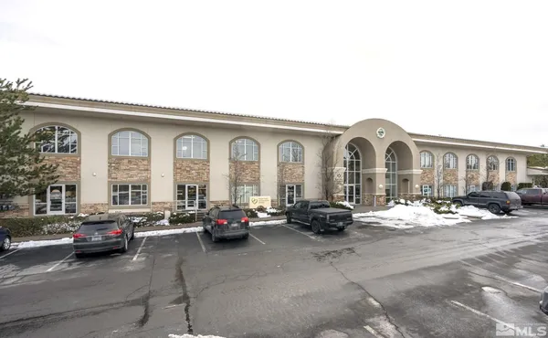 a group of cars parked in front of a house