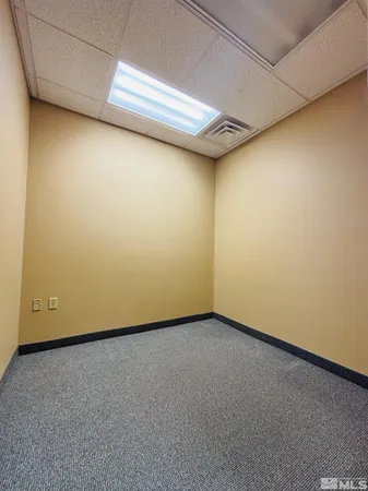 a view of a kitchen with a sink and dishwasher a stove top oven with wooden floor