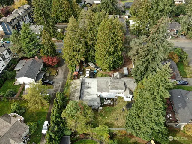 an aerial view of a houses with yard