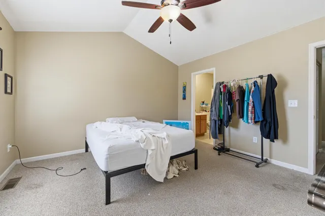 a bed room with a bed and a walk in closet