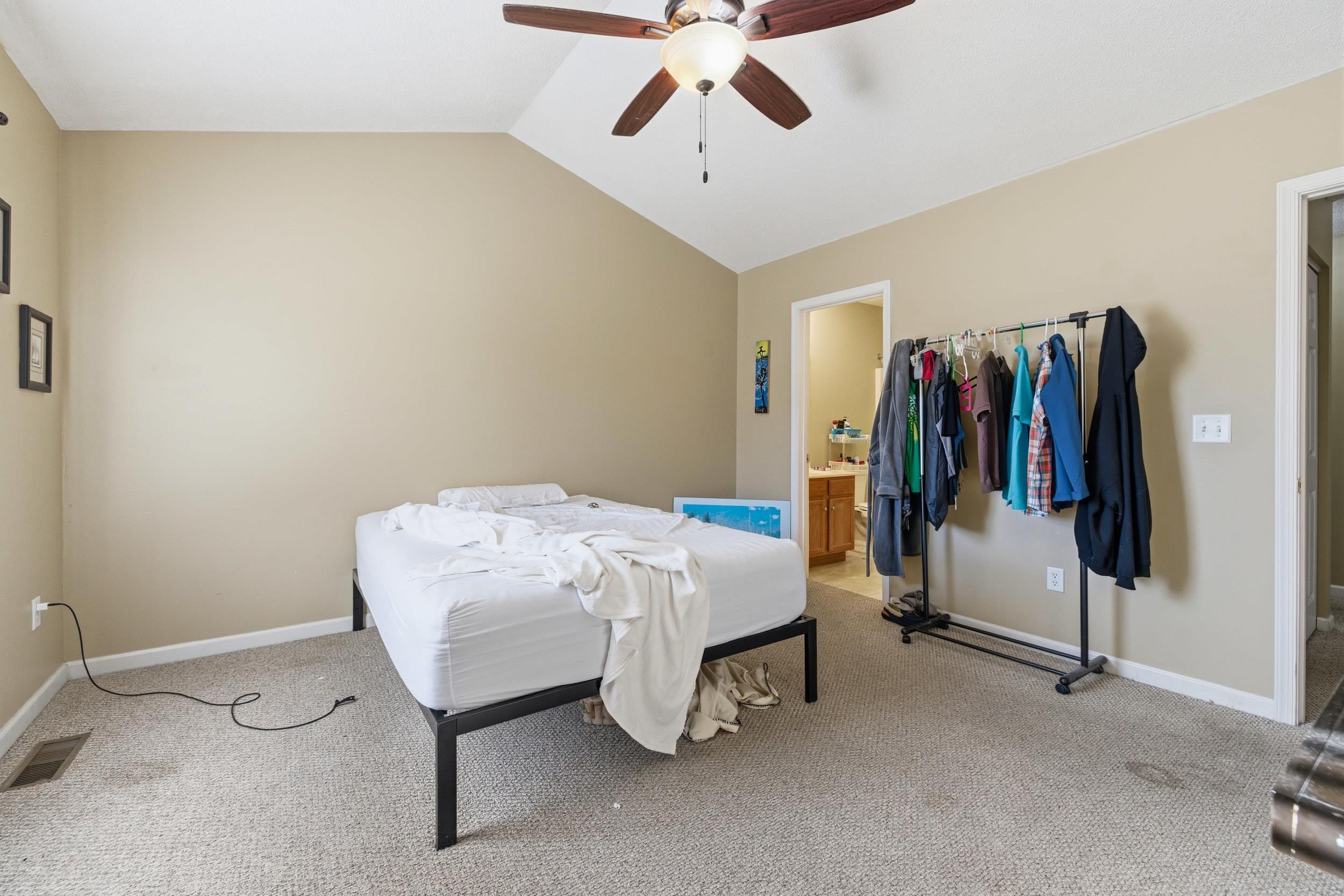 730 Merlins Way Harrisonburg, VA 22801 - Photo 14 of 23 a bed room with a bed and a walk in closet