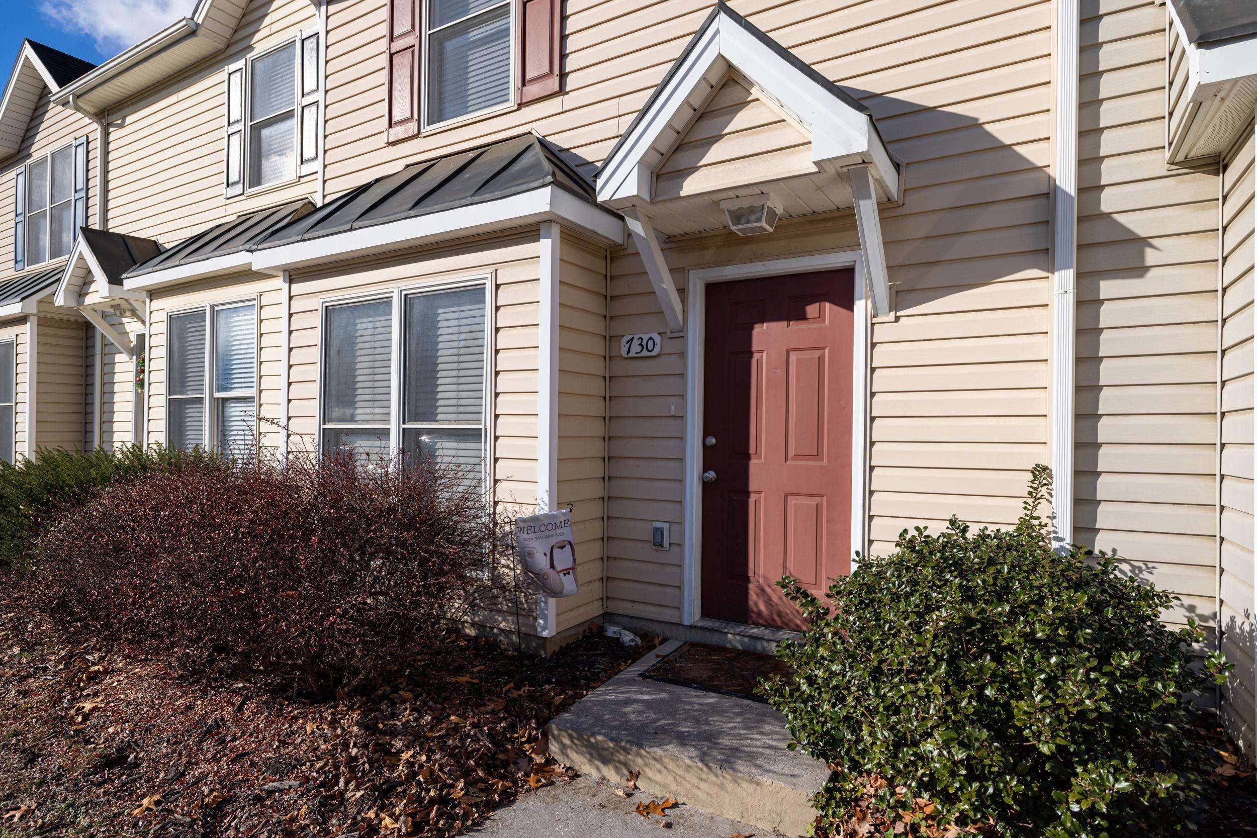 730 Merlins Way Harrisonburg, VA 22801 - Photo 4 of 23 a view of a house with potted plants and a flower garden