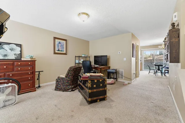 a room with a bed and furniture