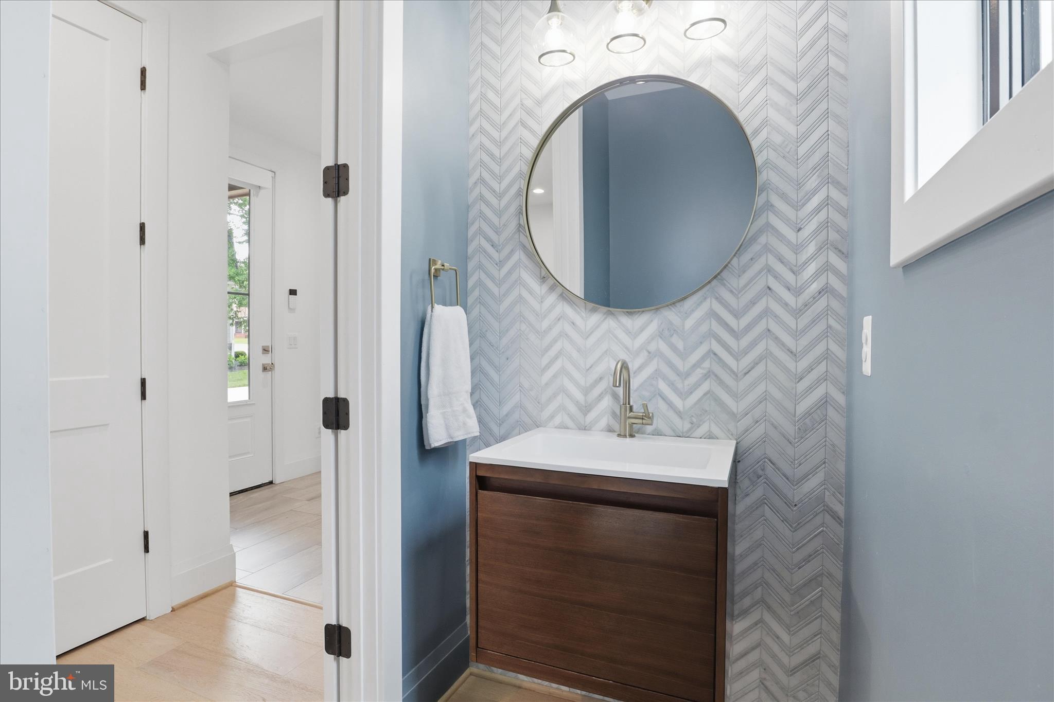 202 Branch Road Southeast Vienna, VA 22180 - Photo 24 of 59 a bathroom with a sink and a mirror