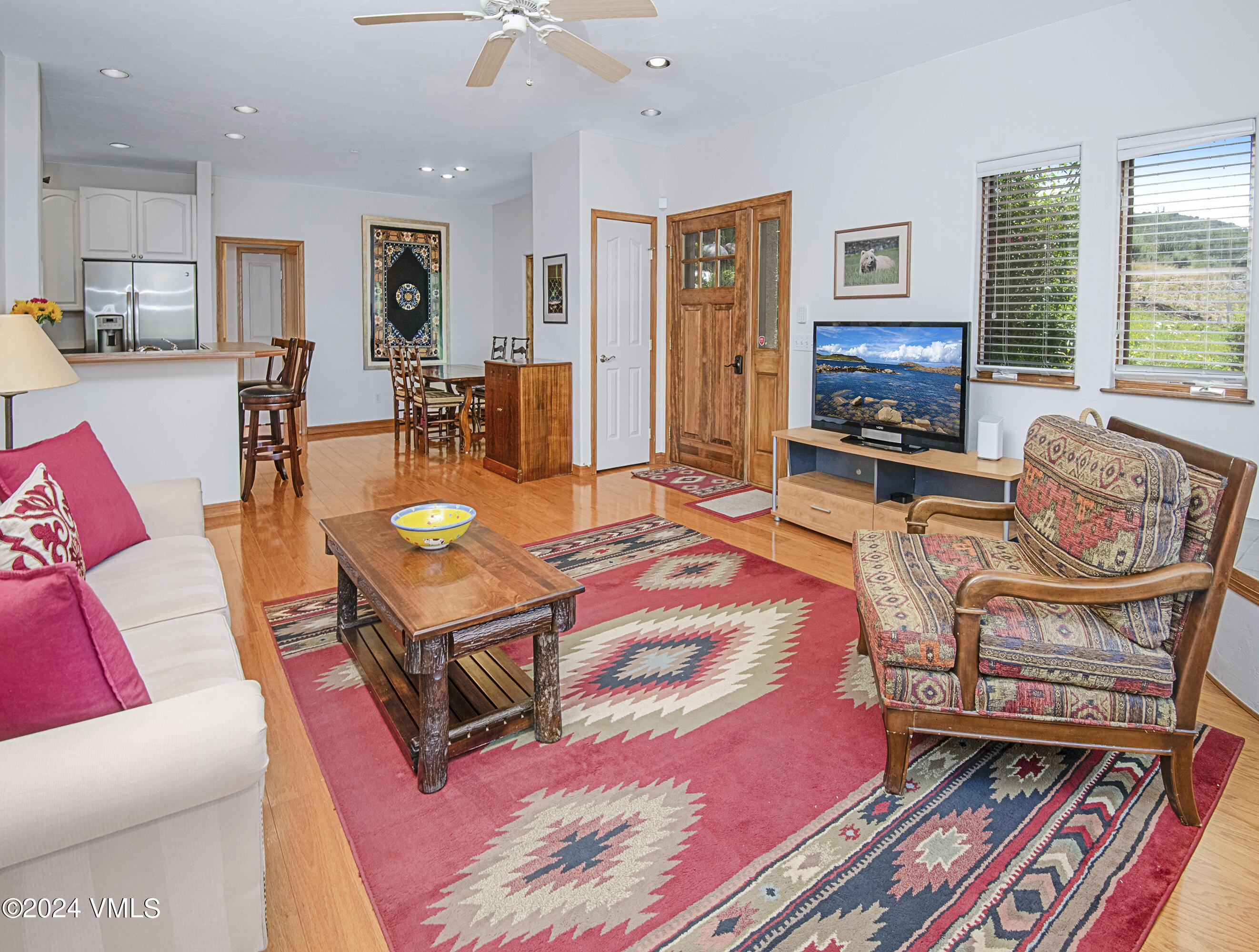 751 Singletree Road, Unit 3N Edwards, CO 81632 - Photo 13 of 35 a living room with furniture a flat screen tv and a fireplace