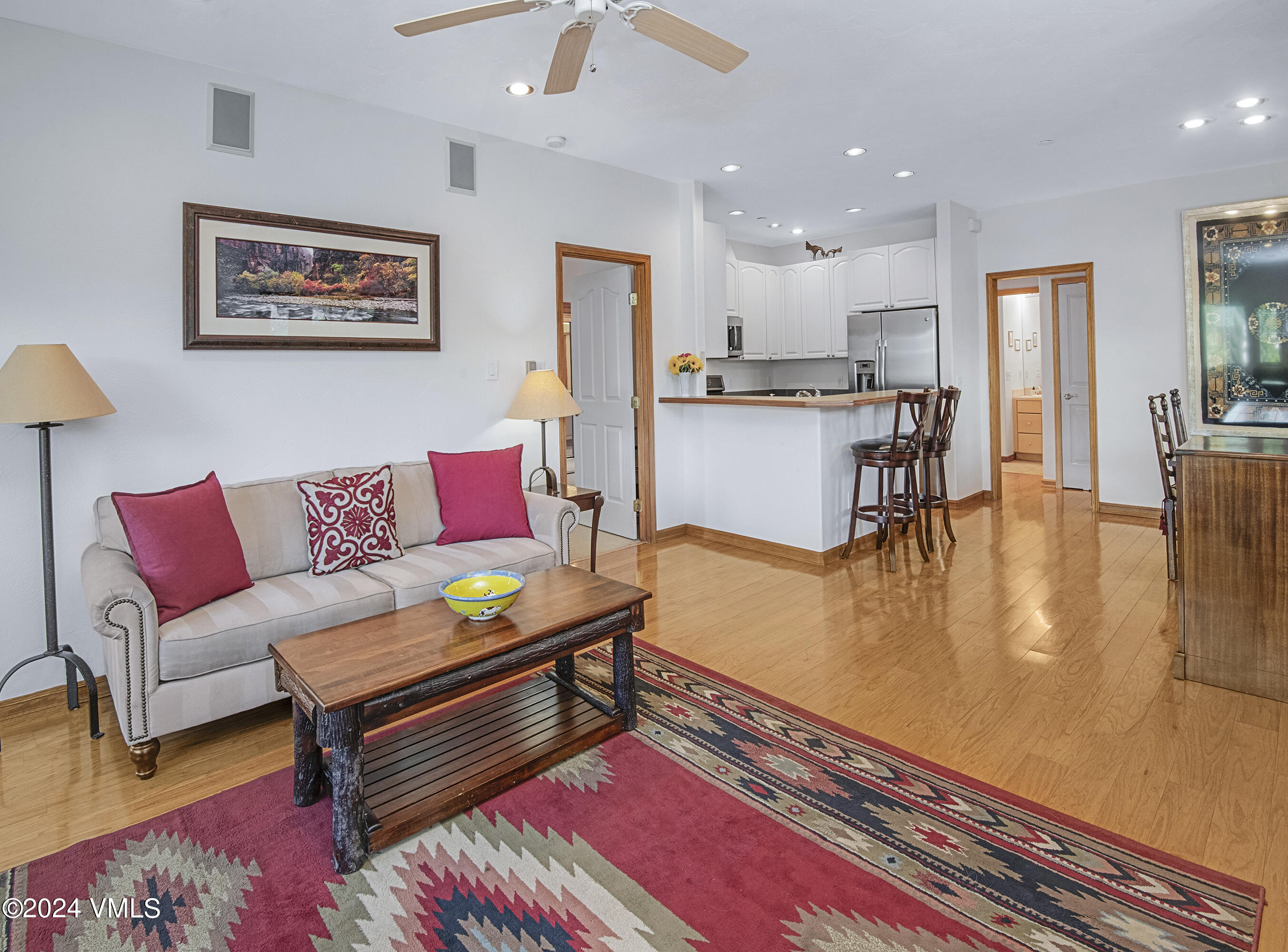 751 Singletree Road, Unit 3N Edwards, CO 81632 - Photo 14 of 35 a living room with furniture and kitchen view with wooden floor