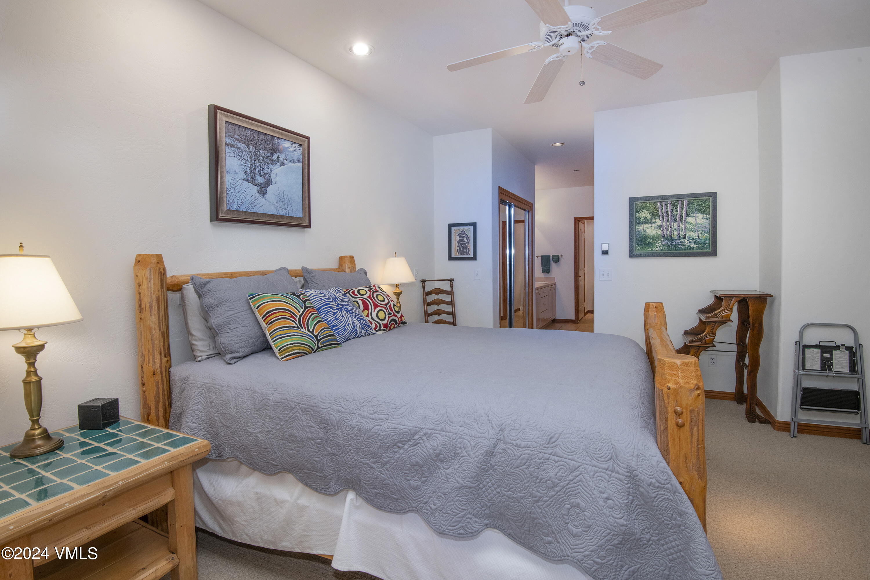 751 Singletree Road, Unit 3N Edwards, CO 81632 - Photo 22 of 35 a bedroom with a bed and a chandelier