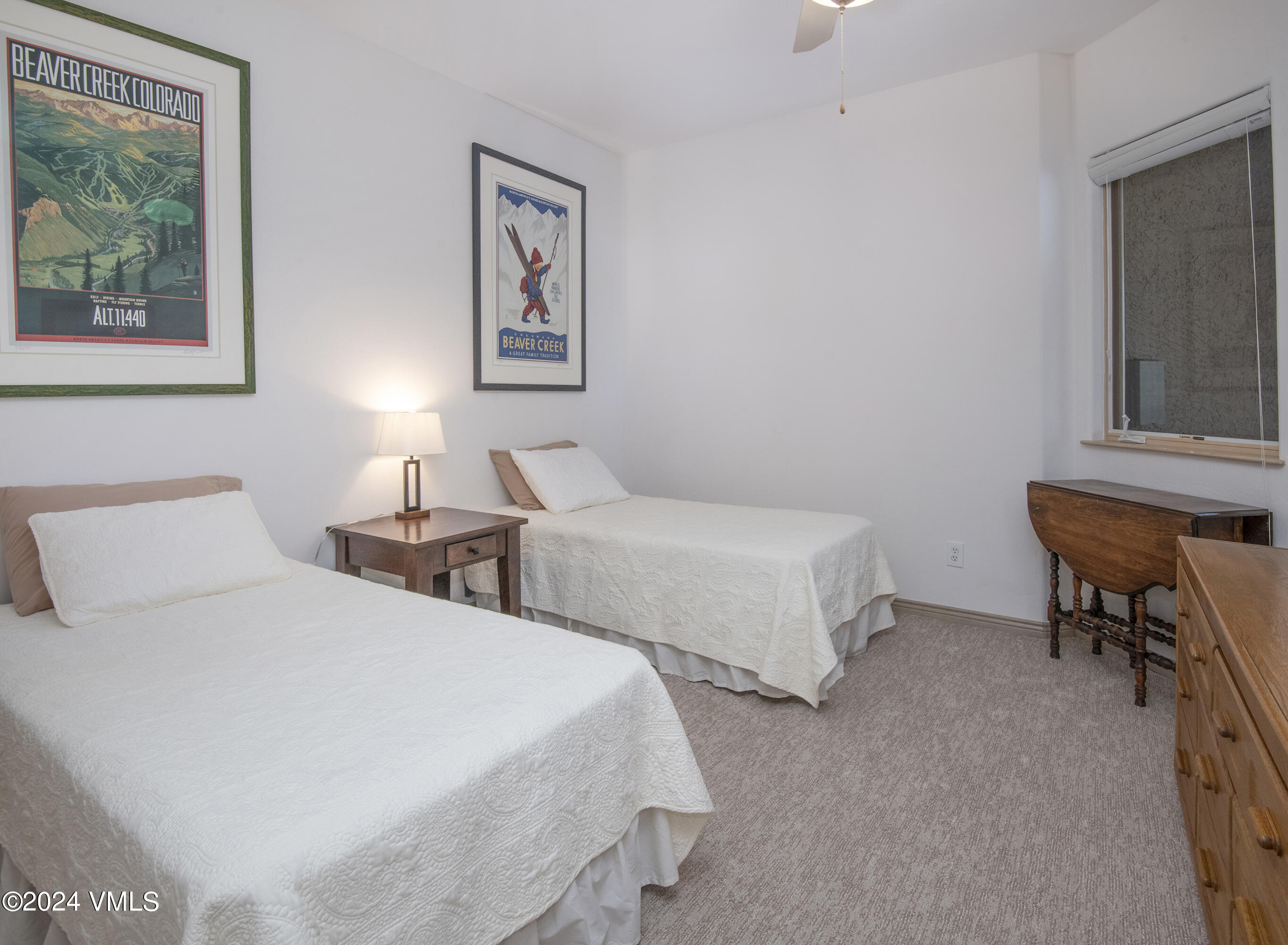 751 Singletree Road, Unit 3N Edwards, CO 81632 - Photo 29 of 35 a bedroom with two beds and painting on the wall