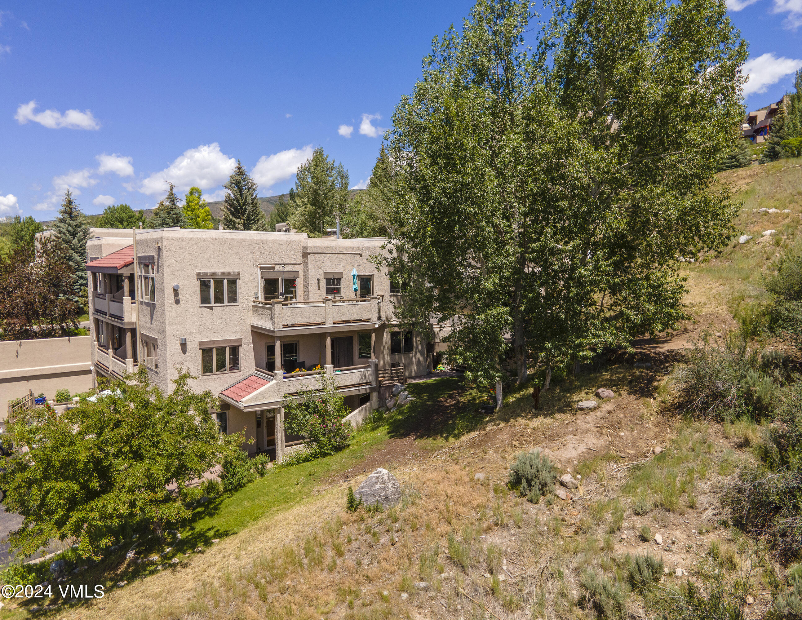 751 Singletree Road, Unit 3N Edwards, CO 81632 - Photo 7 of 35 a view of a house with a yard and garden