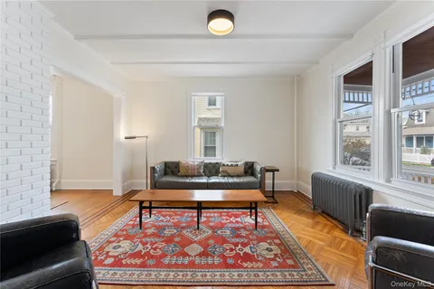 a living room with furniture and a rug