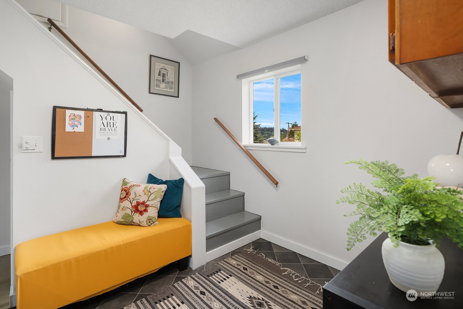 1202 North 29th Street Renton, WA 98056 - Photo 12 of 35 a bedroom with a bed and a potted plant