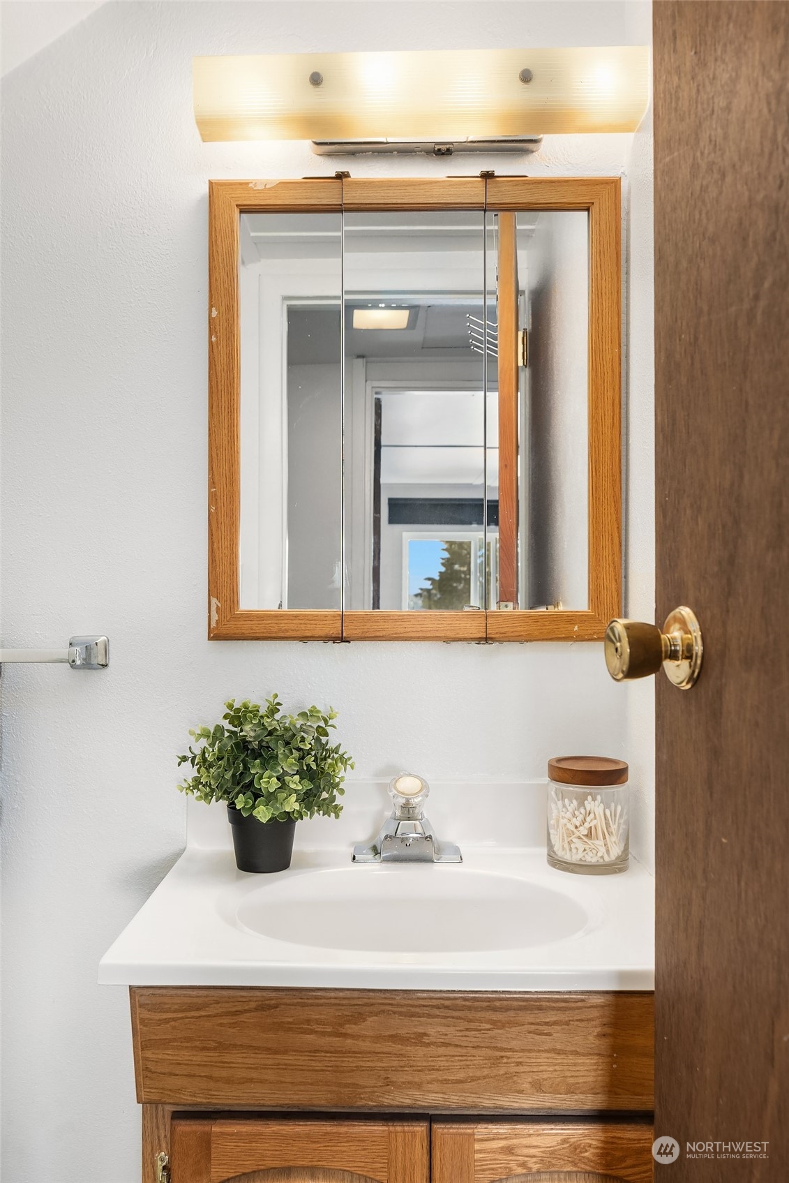 1202 North 29th Street Renton, WA 98056 - Photo 18 of 35 a bathroom with a sink and a mirror
