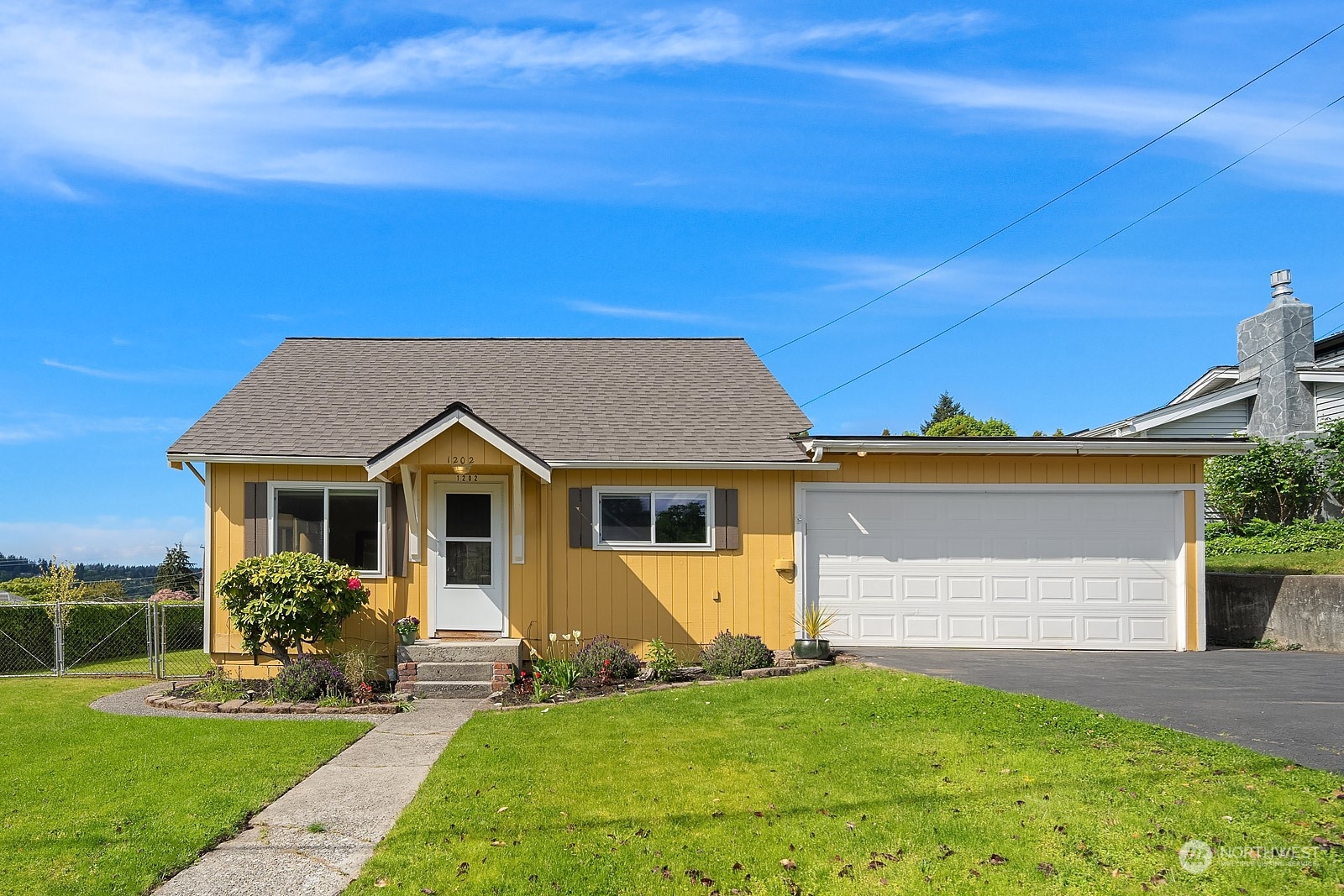 1202 North 29th Street Renton, WA 98056 - Photo 2 of 35 a front view of a house with a yard