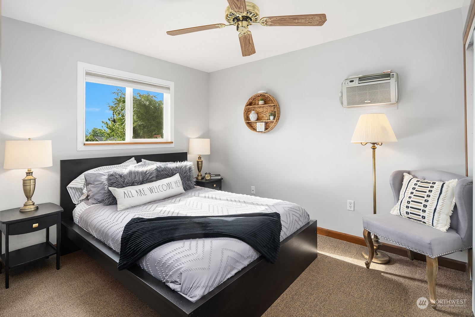 1202 North 29th Street Renton, WA 98056 - Photo 24 of 35 a bedroom with a bed and a chandelier