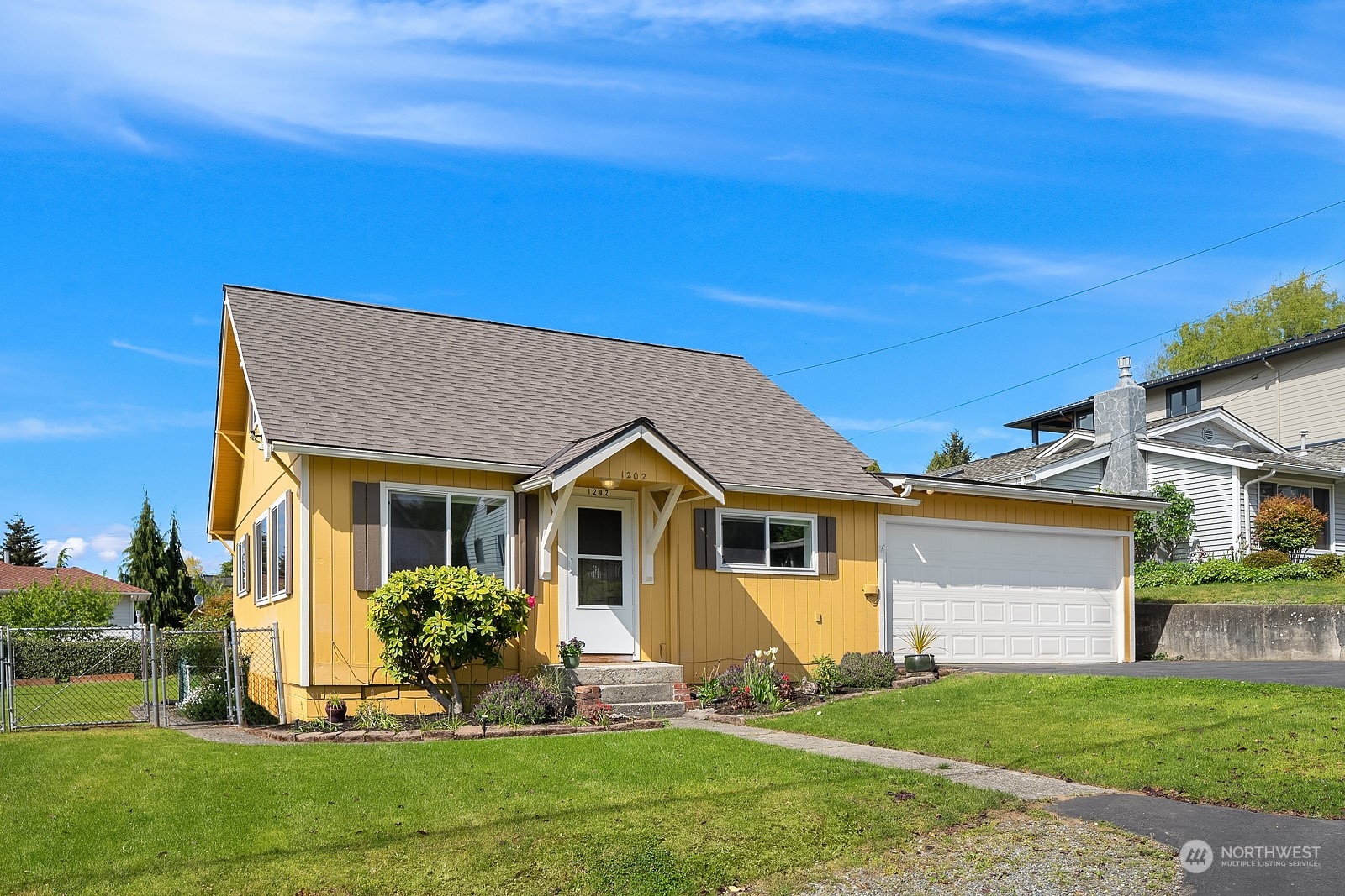 1202 North 29th Street Renton, WA 98056 - Photo 33 of 35 a front view of a house with a yard