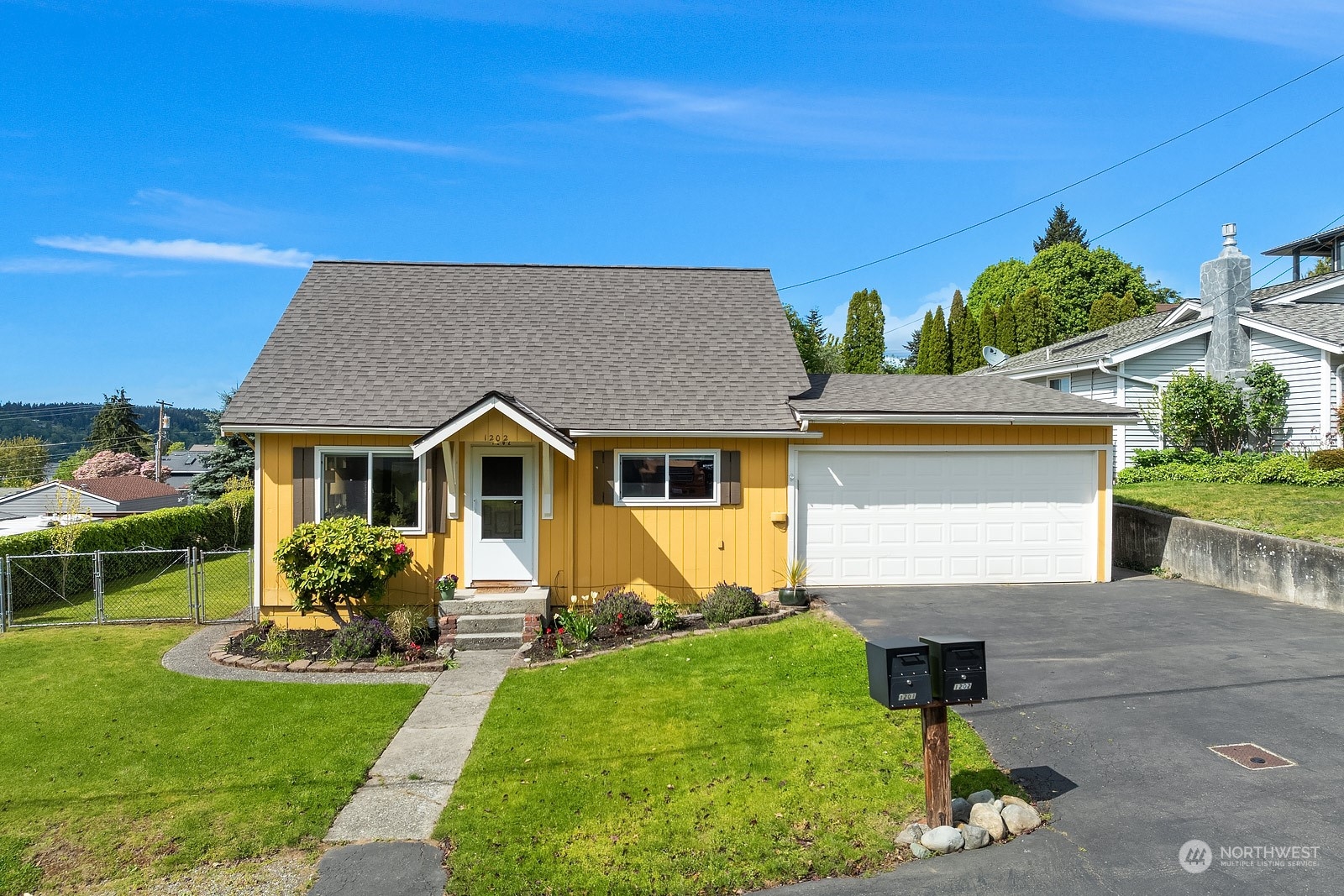 1202 North 29th Street Renton, WA 98056 - Photo 35 of 35 a front view of a house with garden