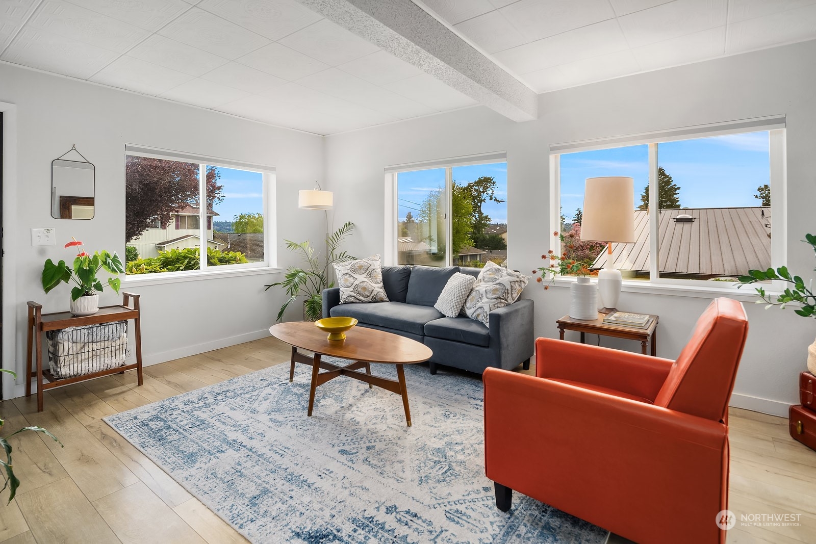 1202 North 29th Street Renton, WA 98056 - Photo 4 of 35 a living room with furniture and a potted plant