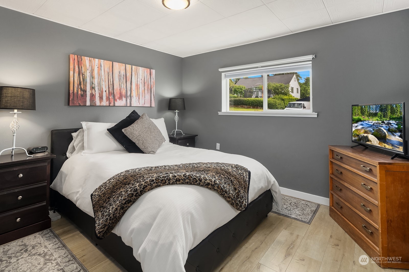 1202 North 29th Street Renton, WA 98056 - Photo 10 of 35 a bedroom with a bed and a dresser