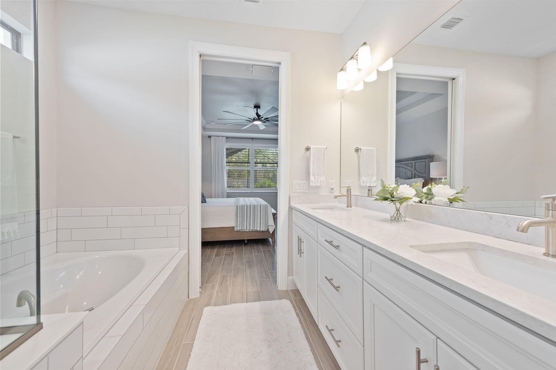2714 Aviamar Circle Naples, FL 34114 - Photo 14 of 53 a spacious bathroom with a tub sink and mirror