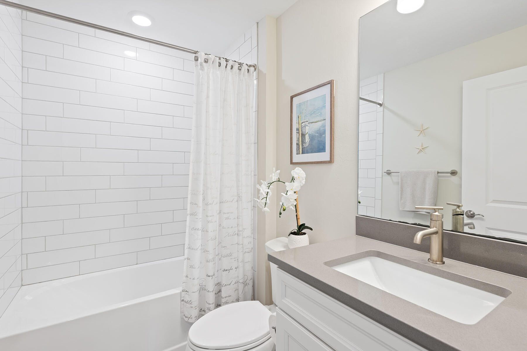 2714 Aviamar Circle Naples, FL 34114 - Photo 18 of 53 a bathroom with a granite countertop sink toilet and shower