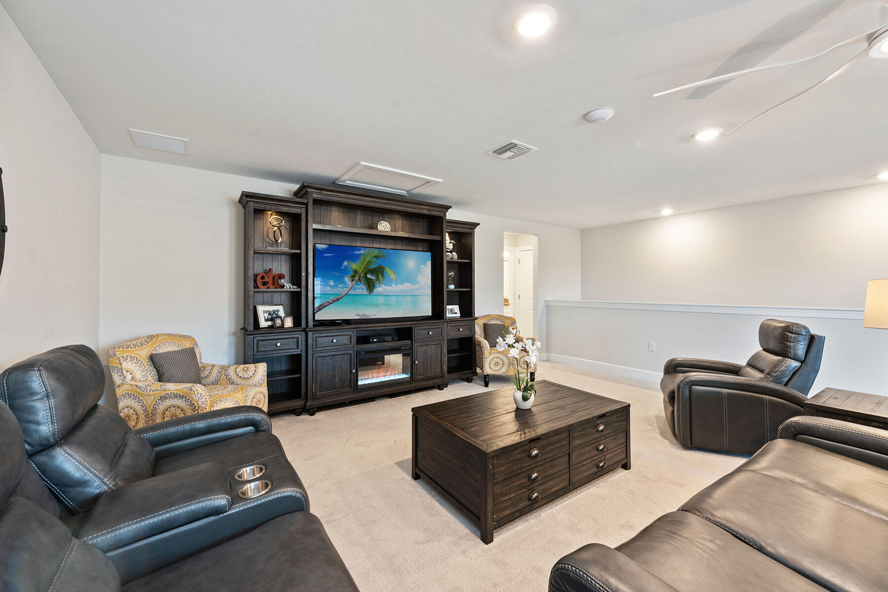 2714 Aviamar Circle Naples, FL 34114 - Photo 20 of 53 a living room with furniture and a flat screen tv