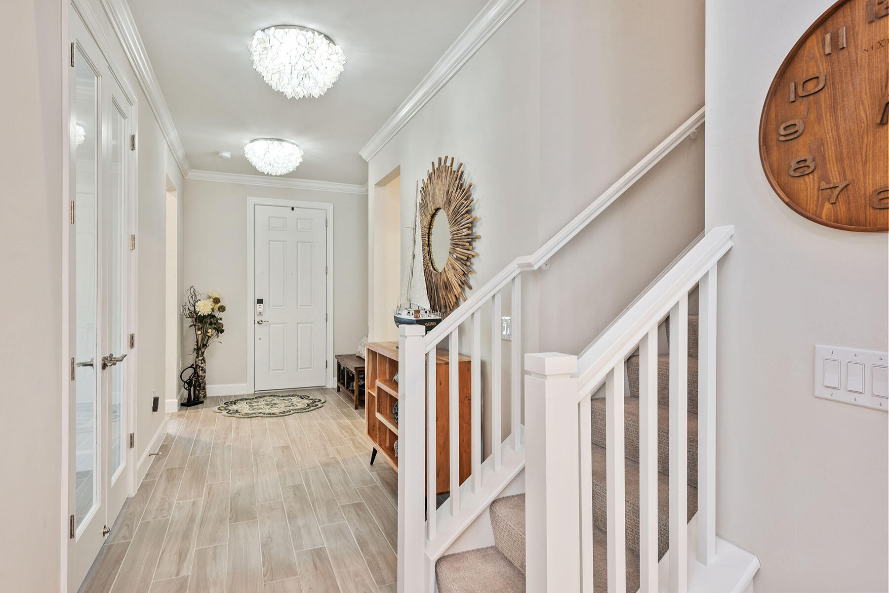 2714 Aviamar Circle Naples, FL 34114 - Photo 2 of 53 a view of a hallway with wooden floor and entryway