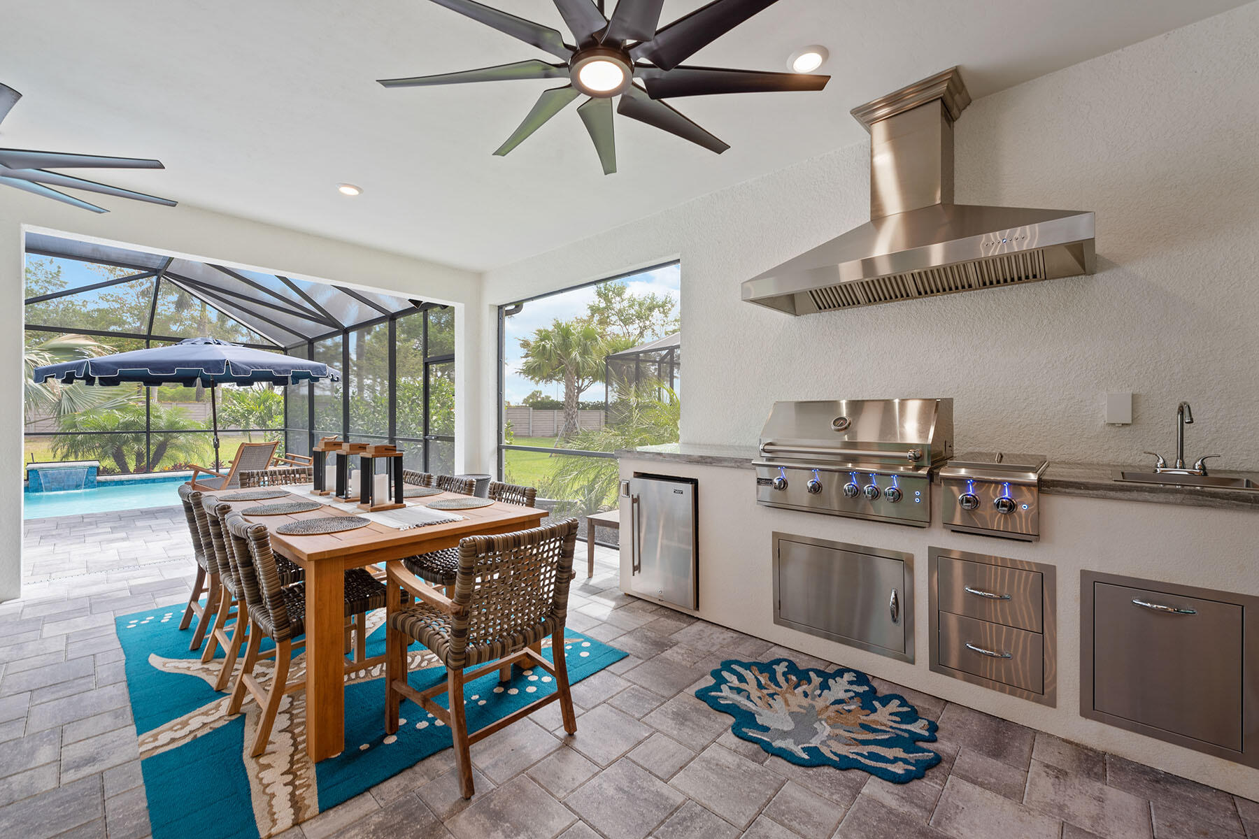 2714 Aviamar Circle Naples, FL 34114 - Photo 24 of 53 a room with a stove a clock and windows