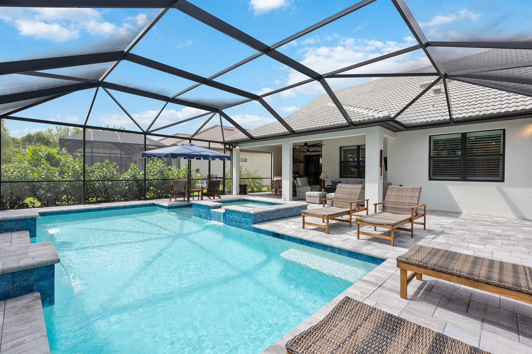 2714 Aviamar Circle Naples, FL 34114 - Photo 27 of 53 a view of a swimming pool with a patio