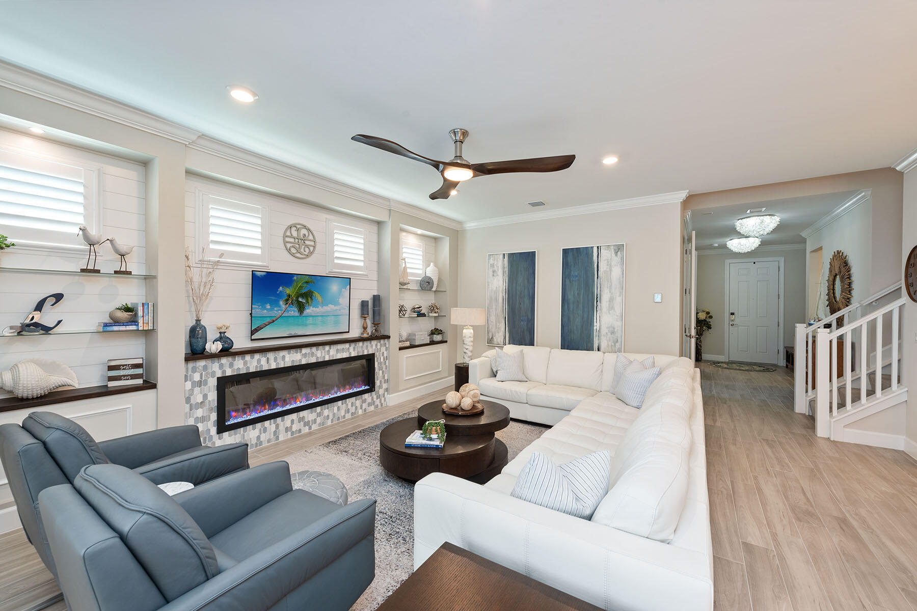 2714 Aviamar Circle Naples, FL 34114 - Photo 3 of 53 a living room with furniture a wooden floor and a large window