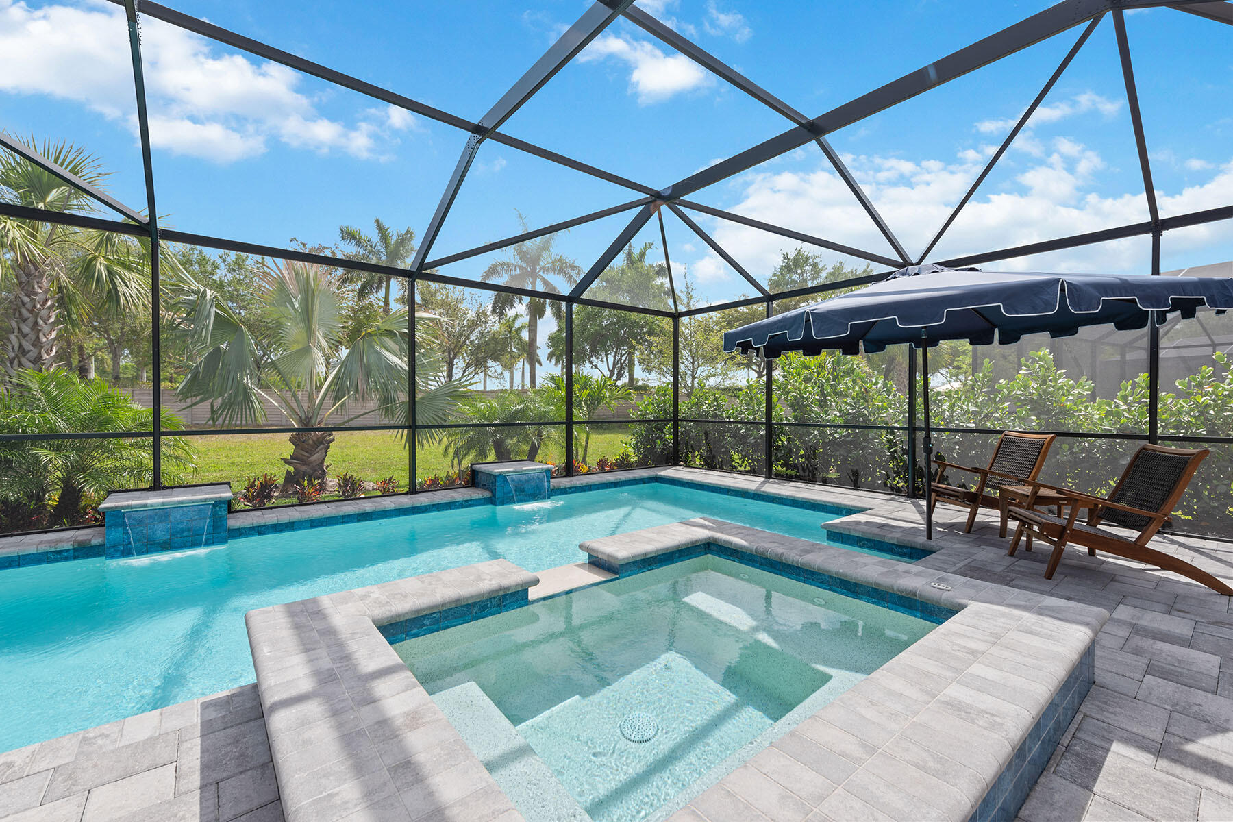 2714 Aviamar Circle Naples, FL 34114 - Photo 31 of 53 a swimming pool with outdoor seating and yard