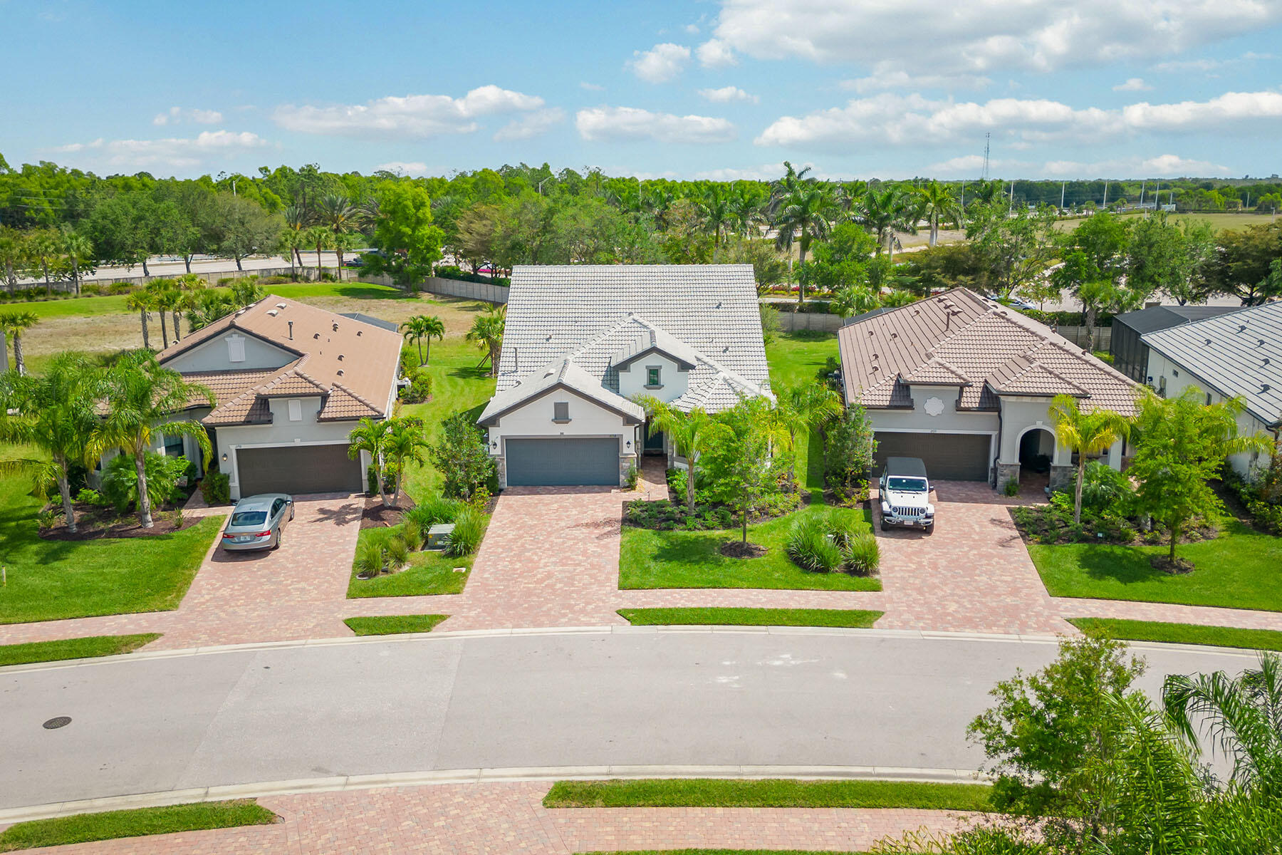 2714 Aviamar Circle Naples, FL 34114 - Photo 33 of 53 an aerial view of multiple houses with a yard