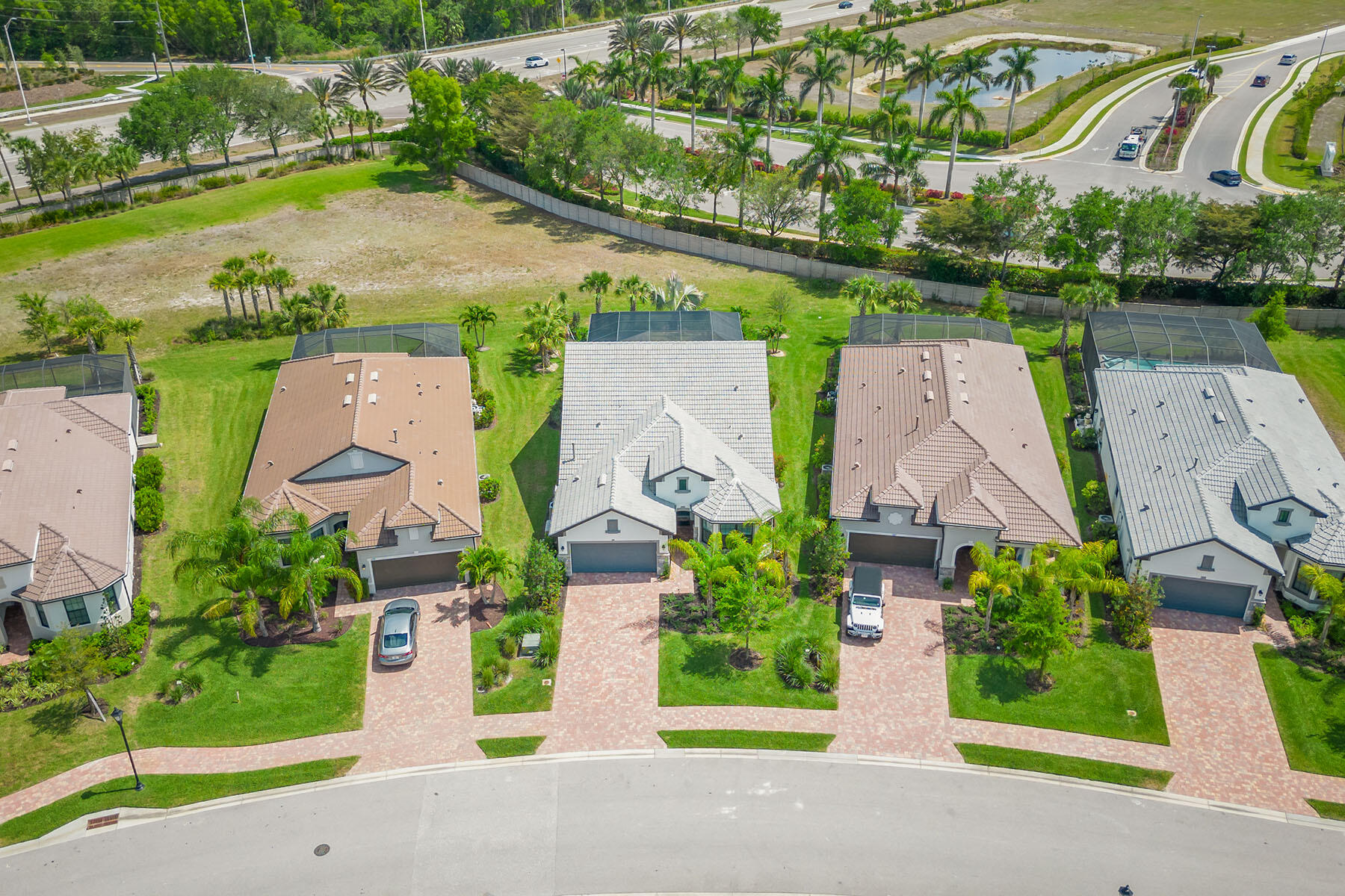 2714 Aviamar Circle Naples, FL 34114 - Photo 34 of 53 an aerial view of a house with garden space and lake view