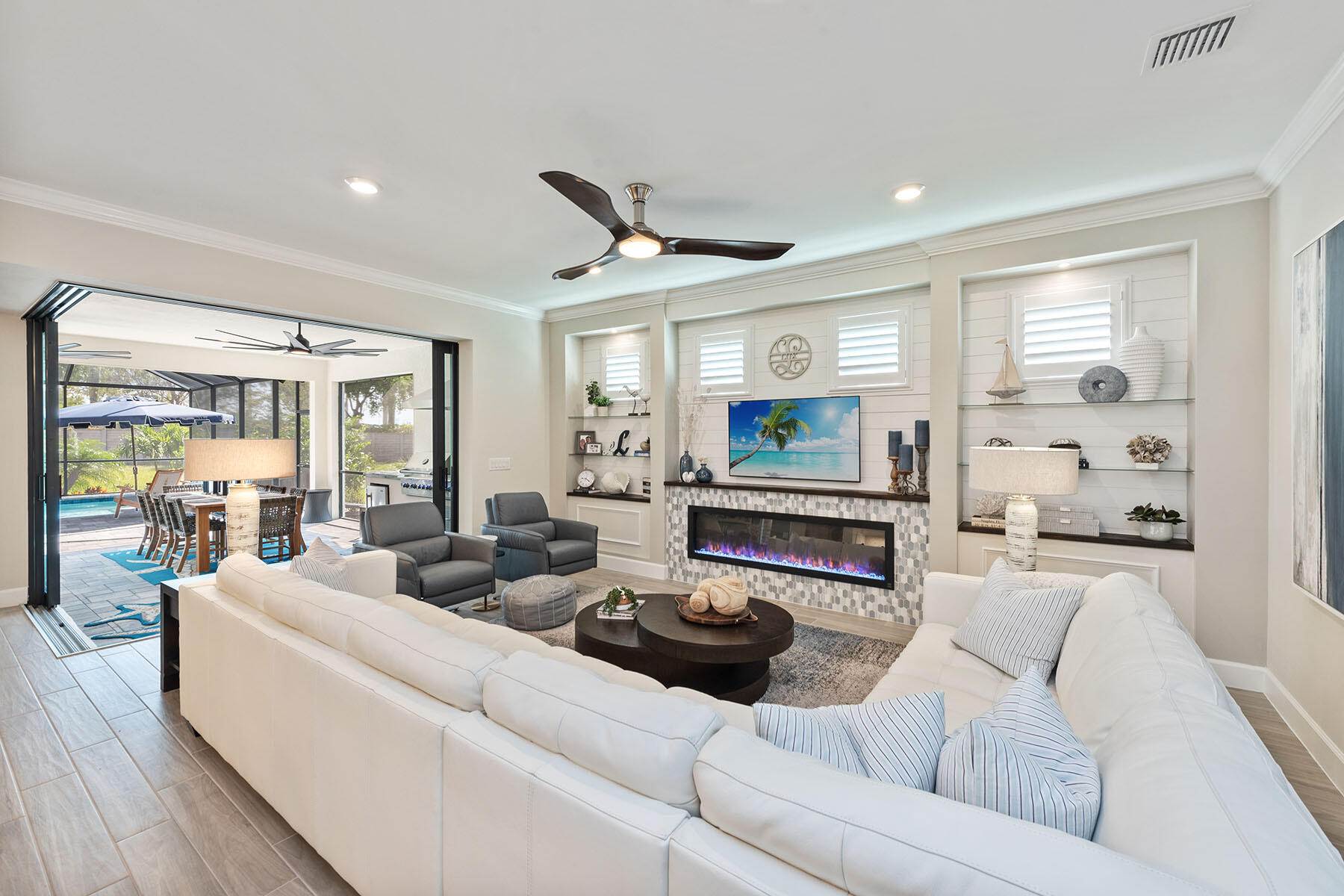 2714 Aviamar Circle Naples, FL 34114 - Photo 5 of 53 a living room with furniture and a fireplace