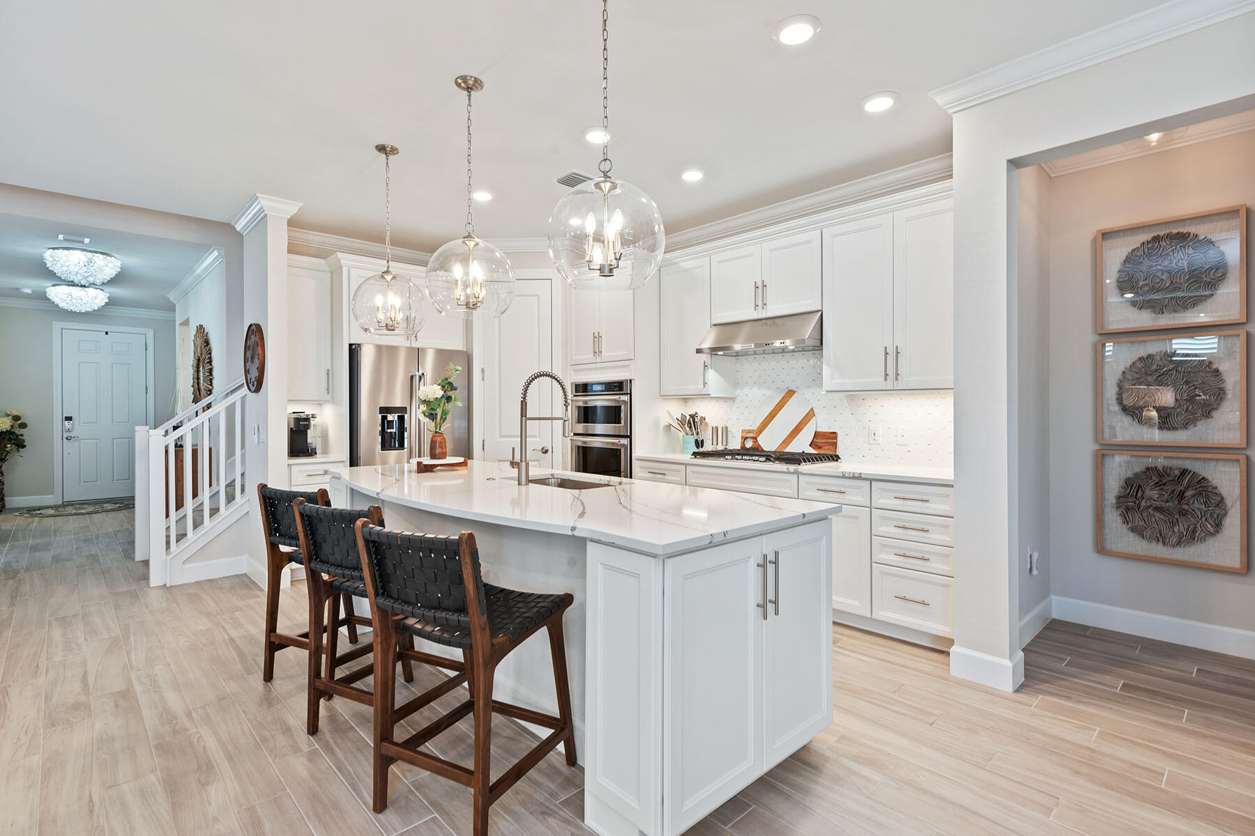 2714 Aviamar Circle Naples, FL 34114 - Photo 6 of 53 a kitchen with a table chairs refrigerator and cabinets