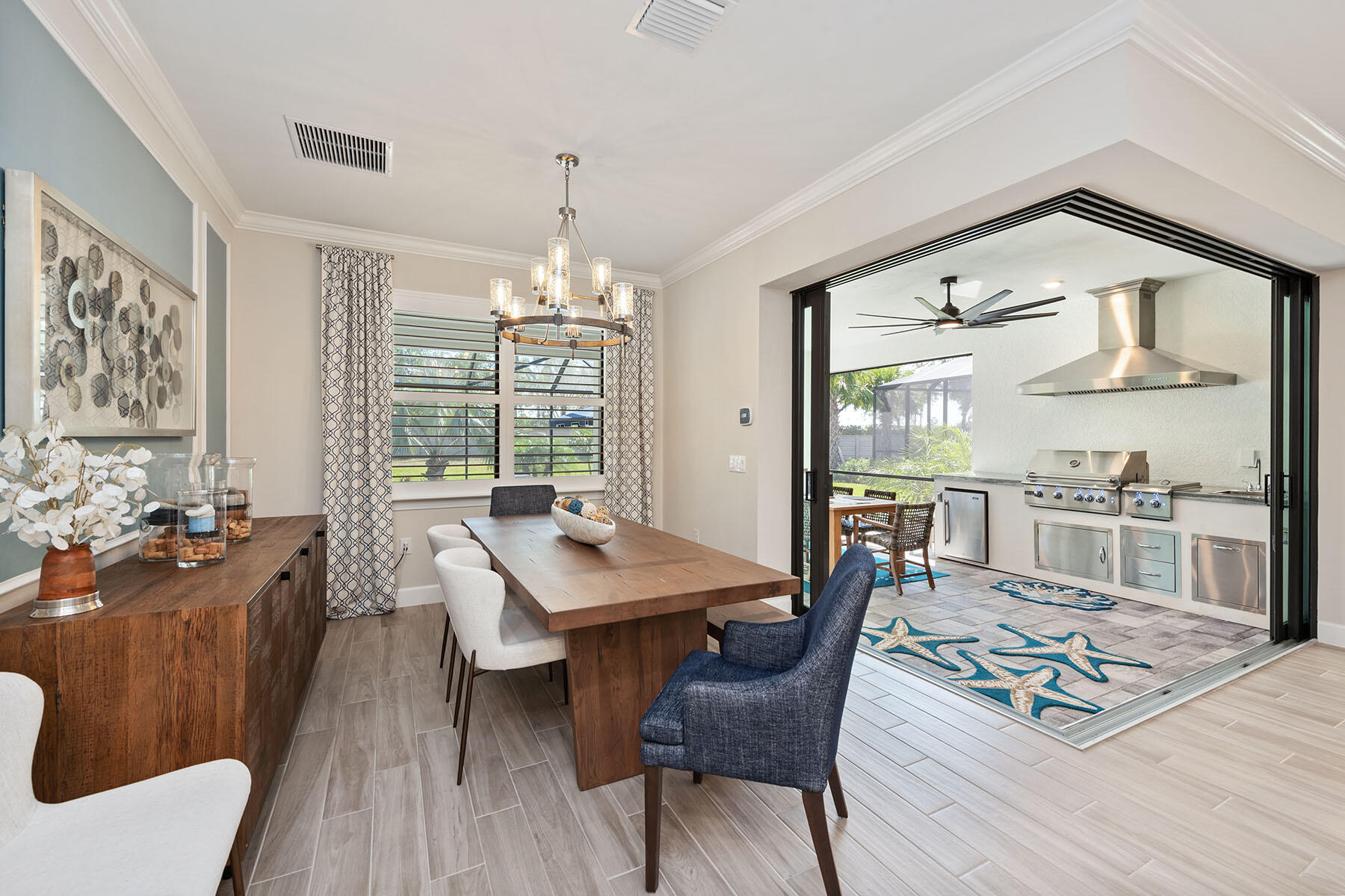 2714 Aviamar Circle Naples, FL 34114 - Photo 9 of 53 a dining room with wooden floor and large windows