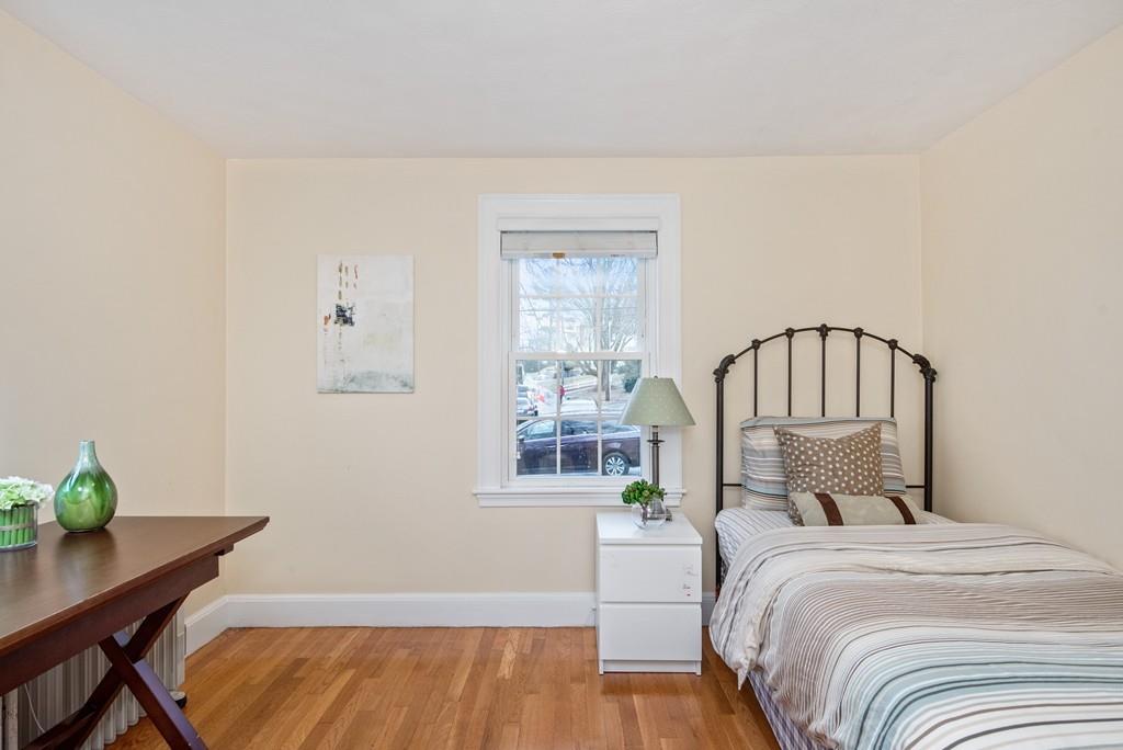 104 Bertwell Road Lexington, MA 02420 - Photo 15 of 32 a bedroom with a bed a window and table
