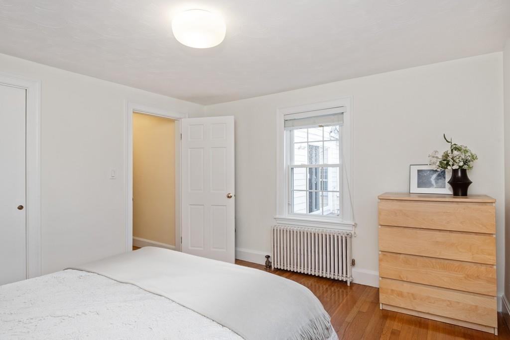 104 Bertwell Road Lexington, MA 02420 - Photo 17 of 32 a bedroom with a bed and a window