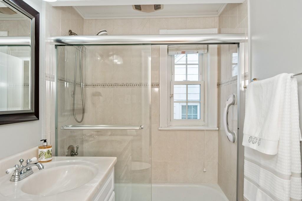 104 Bertwell Road Lexington, MA 02420 - Photo 19 of 32 a bathroom with a sink and a mirror