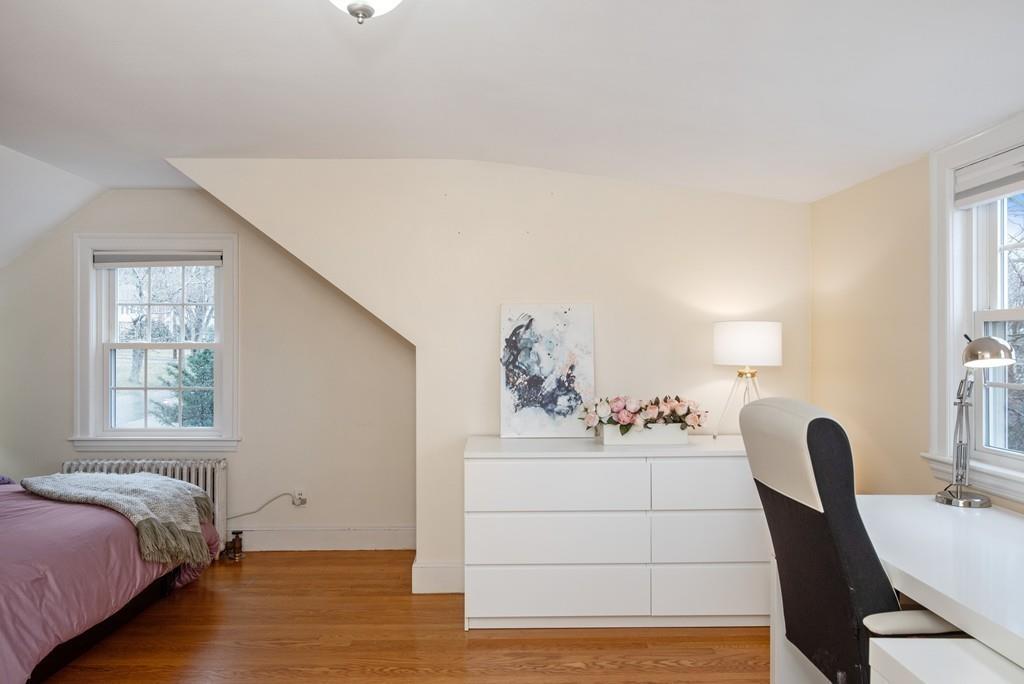 104 Bertwell Road Lexington, MA 02420 - Photo 21 of 32 a bedroom with furniture and wooden floor