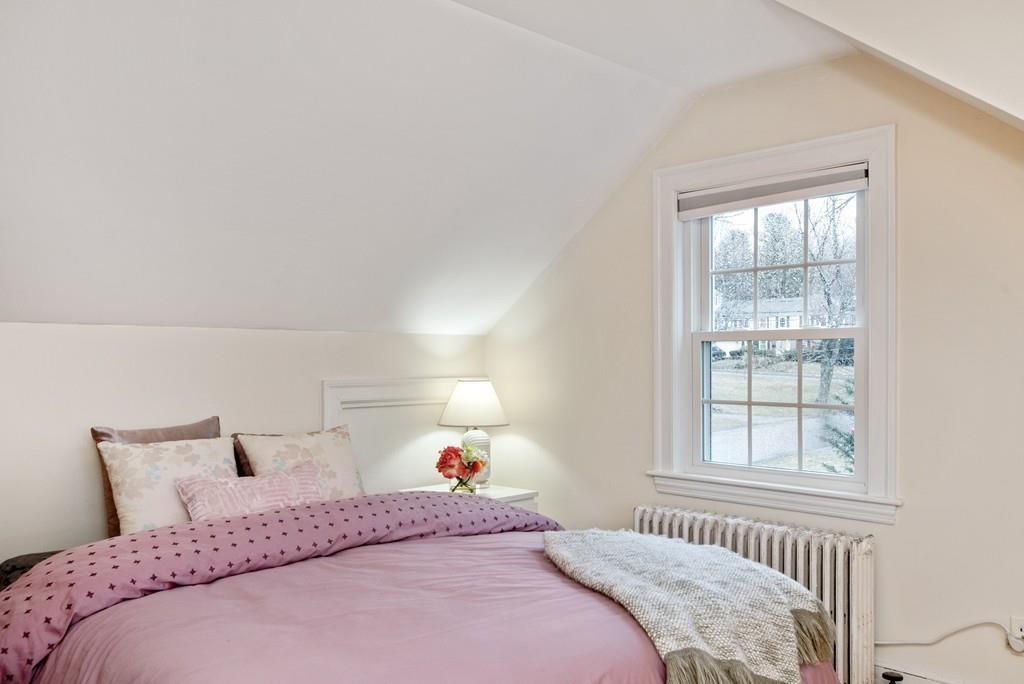 104 Bertwell Road Lexington, MA 02420 - Photo 22 of 32 a bedroom with a bed and a window