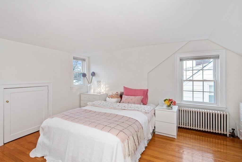 104 Bertwell Road Lexington, MA 02420 - Photo 23 of 32 a bedroom with a bed and a window