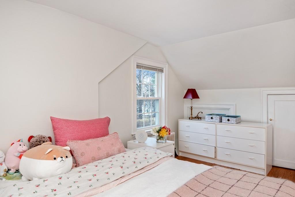 104 Bertwell Road Lexington, MA 02420 - Photo 24 of 32 a bedroom with a bed and window