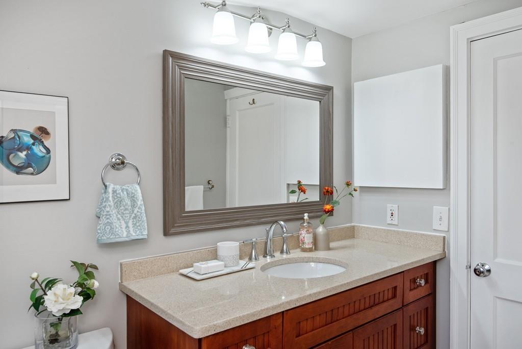 104 Bertwell Road Lexington, MA 02420 - Photo 26 of 32 a bathroom with a sink vanity and a mirror