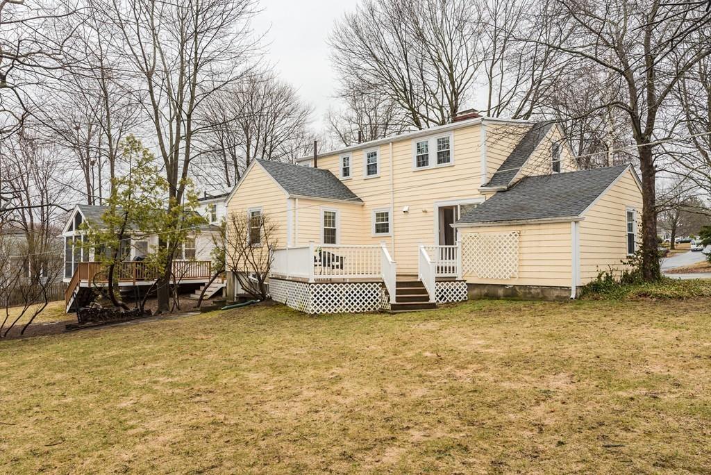 104 Bertwell Road Lexington, MA 02420 - Photo 30 of 32 a white house that has a tree in front of it